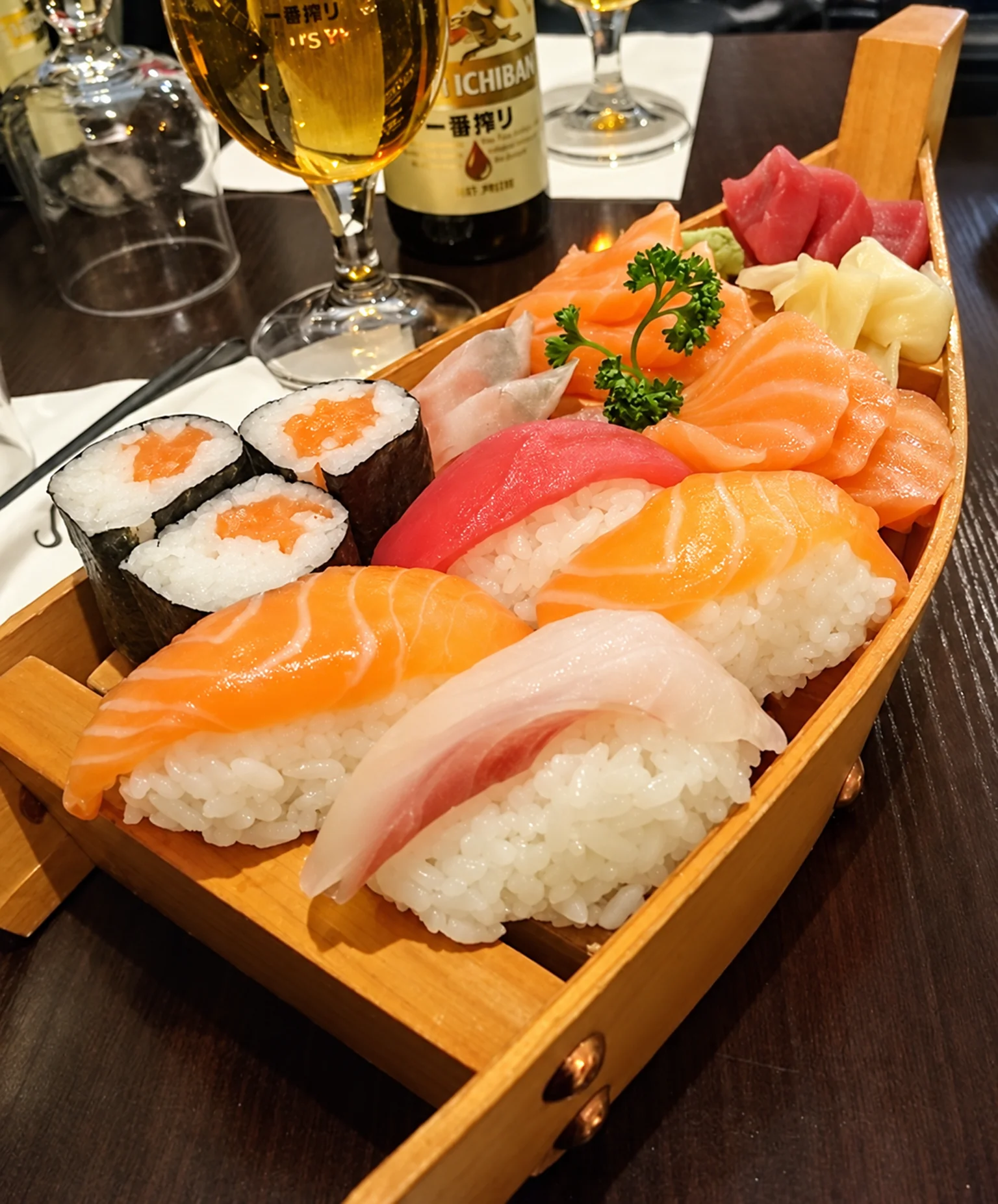 Sushi and sashimi in a wooden boat